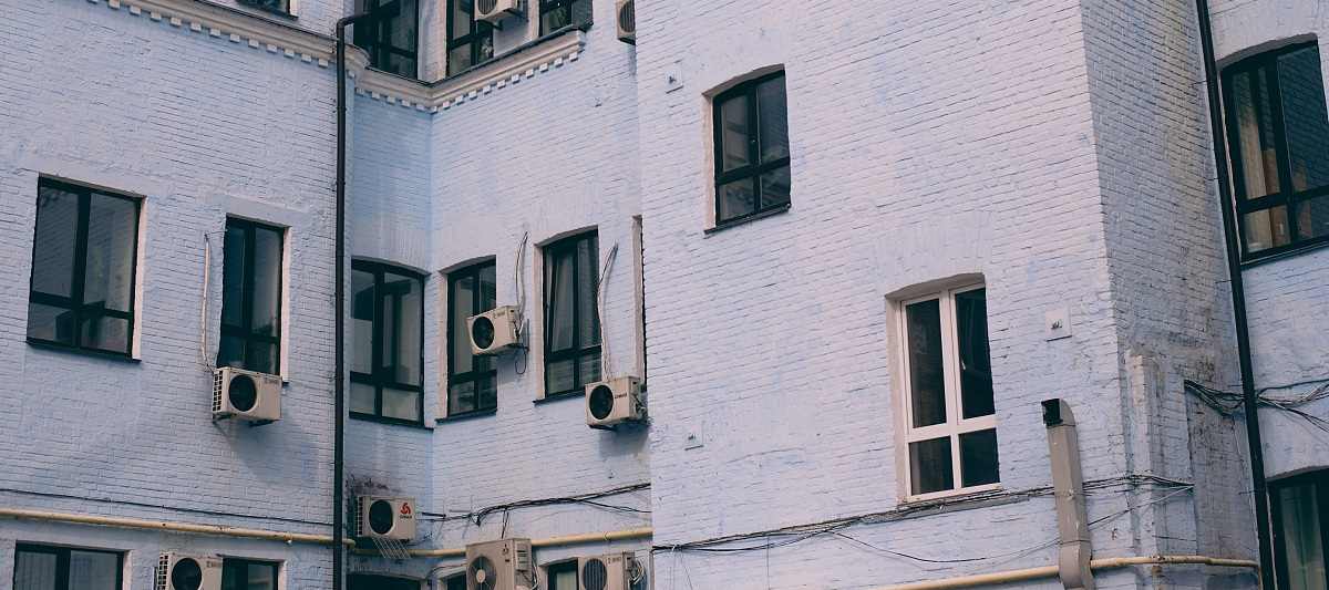 Apartment building with multiple exterior AC units