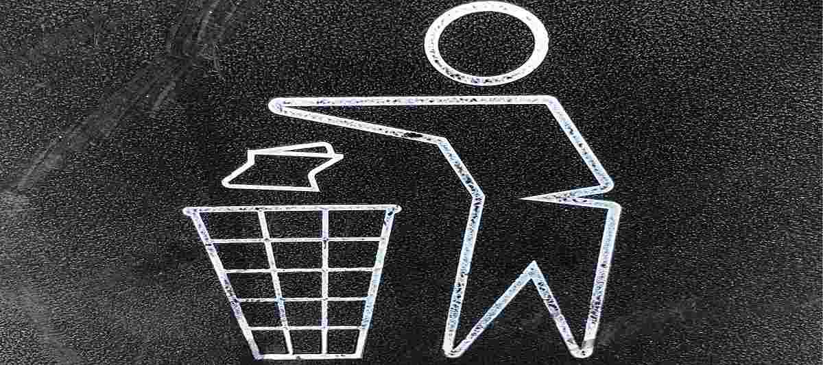 Man throwing trash in bin